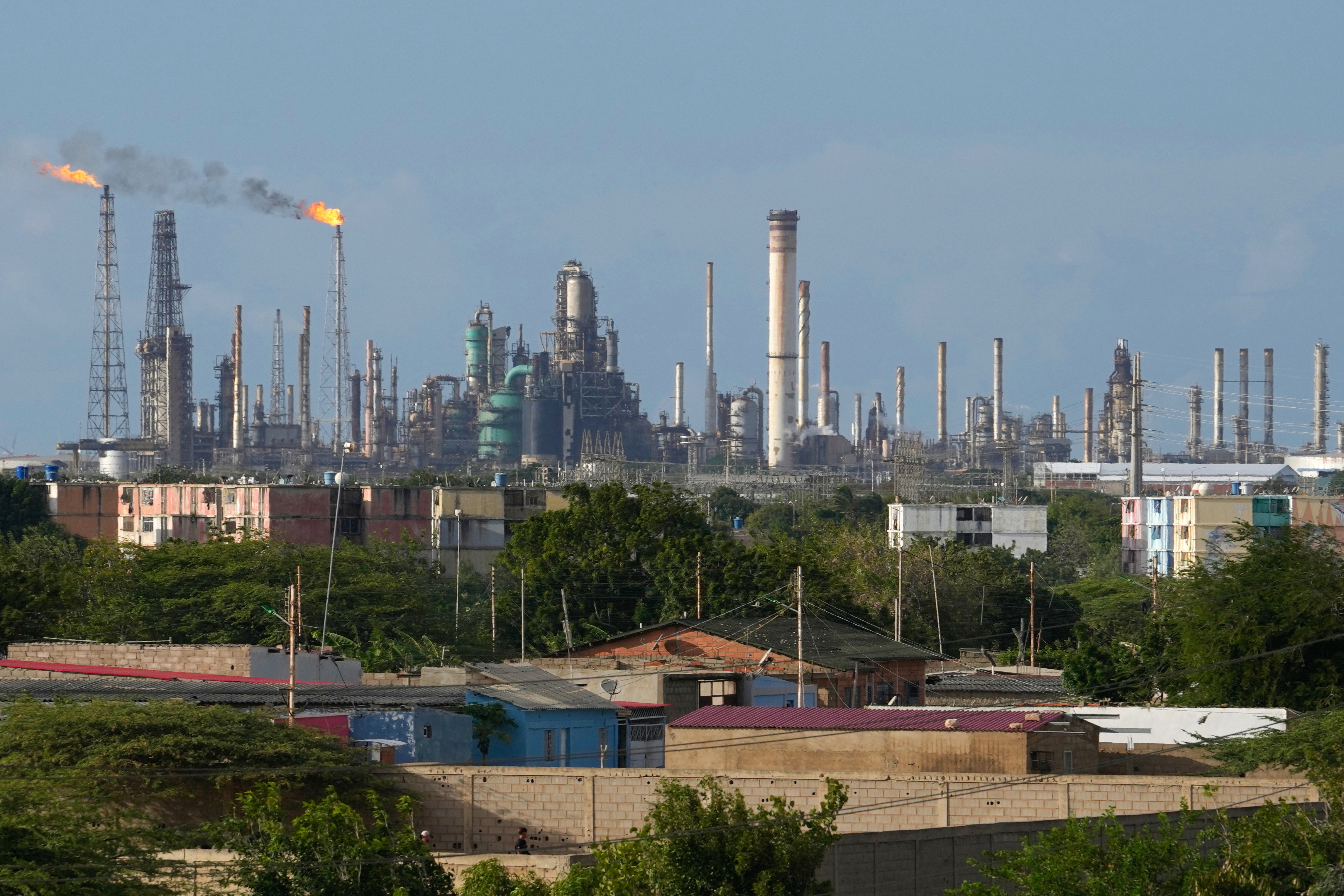 FILE - Flames rise from flare stacks at the Amuay refinery in Los Taques, Venezuela, Jan. 14, 2026.
